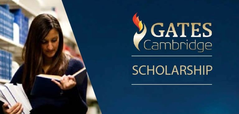 International student studying at University of Cambridge library, with books and laptop, benefiting from Gates Cambridge Scholarship for postgraduate studies.